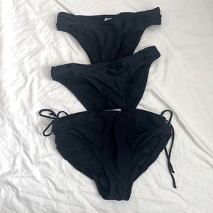 3 Black Womens bathing suite bottoms.